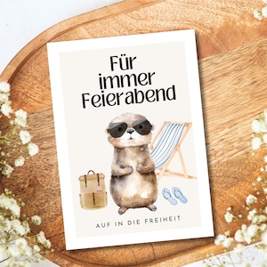 May include: A card with a cartoon otter wearing sunglasses and a backpack. The text on the card reads "F&uuml;r immer Feierabend" and "AUF IN DIE FREIHEIT".