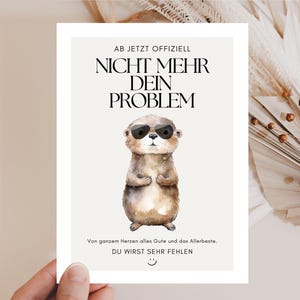 May include: A greeting card featuring a watercolour illustration of an otter wearing sunglasses. The card has German text that reads "AB JETZT OFFIZIELL NICHT MEHR DEIN PROBLEM" and "DU WIRST SEHR FEHLEN."