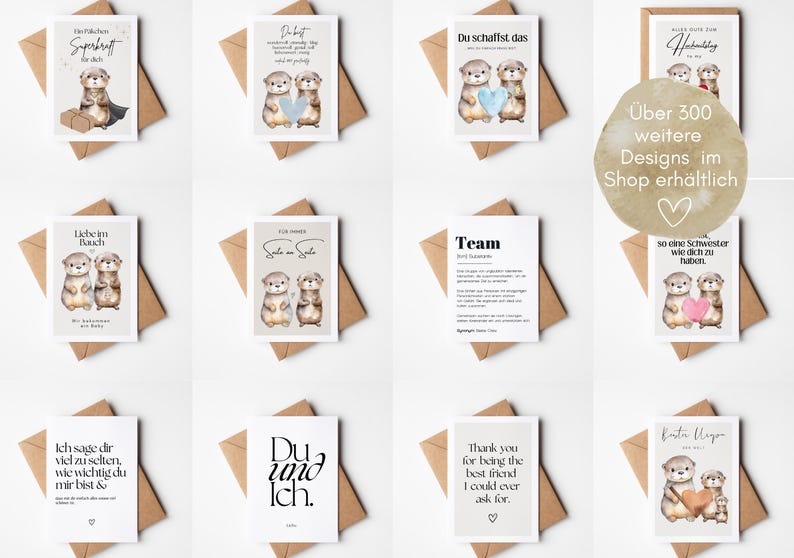 May include: A collection of greeting cards with otter illustrations. The cards feature various messages in German and English, with watercolor-style otter designs holding hearts and other objects. The cards are on a white surface with brown envelopes.