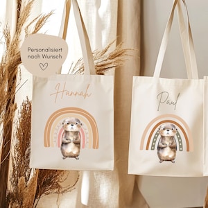 Hej.Otti® Sac personnalisé pour enfants avec arc-en-ciel et jolie loutre, sac en tissu avec nom pour garderie, inscription scolaire, maternelle