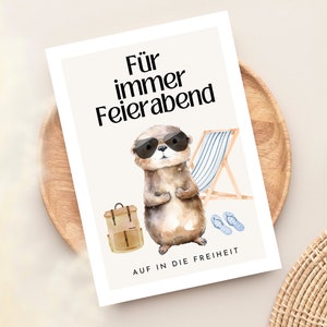 May include: A card with a watercolor illustration of an otter wearing sunglasses and a backpack. The text on the card reads "F&uuml;r immer Feierabend" and "Auf in die Freiheit".