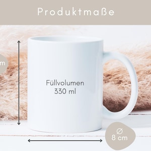 May include: White ceramic mug with a black text that says "F&uuml;lllvolumen 330 ml". The mug is 9.5 inches tall and 8 inches wide.