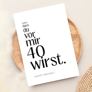May include: A white card with black text that reads "Danke, dass du vor mir 40 wirst. Happy Birthday."