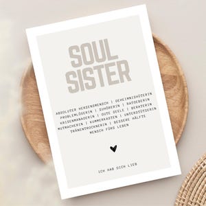May include: A printable poster with the words "Soul Sister" in large, bold letters. The poster lists qualities of a soul sister, such as "absolute heart person", "secret keeper", "problem solver", "listener", "advisor", "crisis manager", "good soul", "counselor", "encourager", "grief box", "supporter", "tear dryer", "better half", and "person for life". The poster also includes the phrase "I love you" in German.