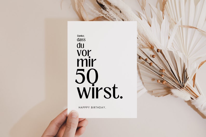 May include: A white card with black text that reads "Danke, dass du vor mir 50 wirst."  Happy Birthday.