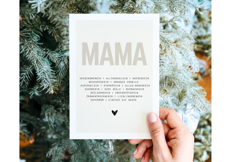 May include: A beige card with the word "MAMA" in large, bold, brown letters. Below the word are a list of words describing a mother, such as "heart person", "everyday hero", "supermom", and "simply the best".