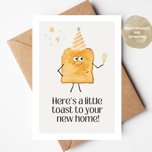 May include: A greeting card featuring a cartoon toast character with a party hat and champagne. The card says "Here's a little toast to your new home!" and is set against a white backdrop with a brown envelope.