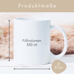 May include: White ceramic mug with black text that says "F&uuml;lllvolumen 330 ml". The mug is 9.5 cm tall and 8 cm wide.