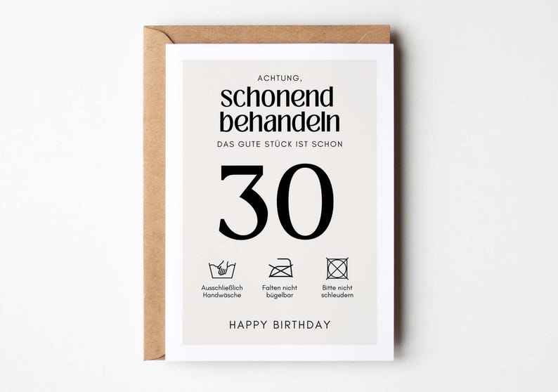 May include: A white card with black text that reads "ACHTUNG, schonend behandeln DAS GUTE ST&Uuml;CK IST SCHON 30" with three black and white laundry care symbols below the number 30. The text "HAPPY BIRTHDAY" is at the bottom of the card.