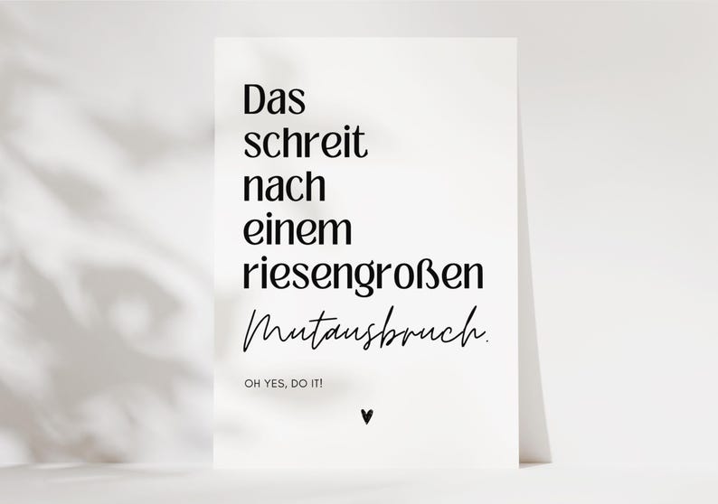 May include: A white card with black text that reads "Das schreit nach einem riesengro&szlig;en Mutansbruch. OH YES, DO IT!" with a small black heart at the bottom.