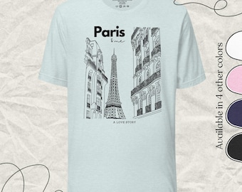 Puede incluir: Camiseta azul claro con una ilustración en blanco y negro de la Torre Eiffel en París, con el texto "Paris & me" y "A Love Story". Disponible en otros cuatro colores.