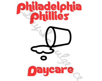 May include: Red and white text reads "Philadelphia Phillies" above a black line drawing of a tipped over cup with a white liquid spilling out. Below the cup, the text reads "Daycare" in red.