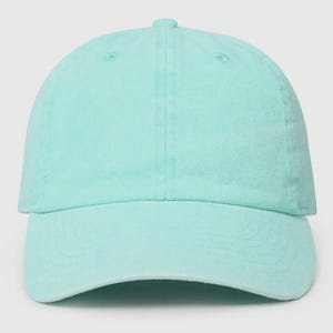 May include: A plain, light blue baseball cap. The cap has a curved brim and a structured crown.