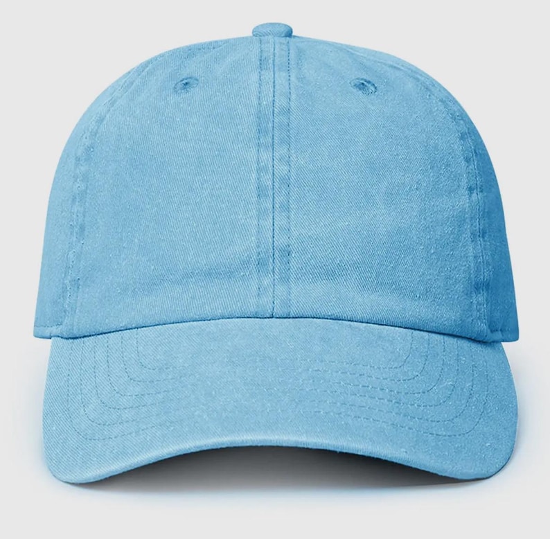 May include: A light blue baseball cap made of cotton. The cap has a curved brim and a structured crown.