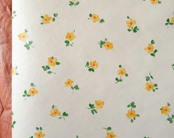 Vintage 1990’s buttercup floral Linda Beard wallpaper rolls.