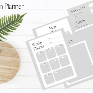 May include: A printable planner set for busy moms, featuring a weekly planner, a meal planner, and a daily planner with a Sunday template. The pages are gray with black text and are designed to be edited in Canva.