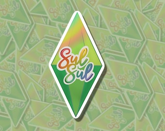 May include: A green diamond-shaped sticker with a holographic finish. The sticker has the text "Sul Sul" written in rainbow colors.
