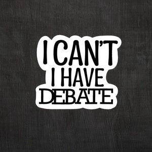 May include: White sticker with black text that reads "I can't I have debate".