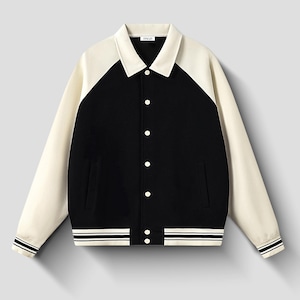 May include: A black and cream varsity jacket featuring a pointed collar, long raglan sleeves, and a front button closure. The cuffs and hem are finished with ribbed knit detailing in black and white stripes. A small white label reads RSGH.