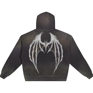 May include: Black hooded sweatshirt with a white graphic print of a bat with wings spread out on the back.