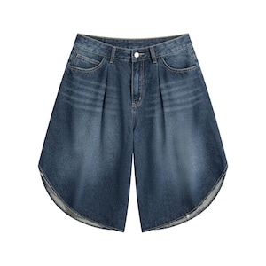 May include: Dark blue denim shorts featuring a high-waisted design with front pleats, a button and zipper fly closure, two side pockets, and a wide, flared leg silhouette with curved, raw-edge hems that create a distinctively rounded shape.