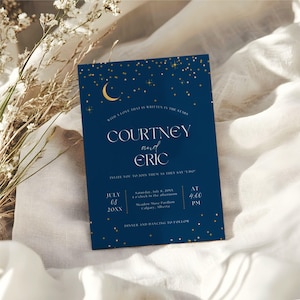 May include: A navy blue wedding invitation with gold detailing. The invitation features the names "Courtney and Eric" in elegant script, along with event details. The design includes a crescent moon, stars, and the text "With a love that is written in the stars."