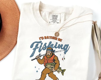 Comfort Colors I’d Rather Be Fishing Shirt, Funny Bigfoot Fishing Tee, Sasquatch Lover Gifts