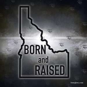 May include: Black and white graphic of the state of Idaho with the text "BORN and RAISED" inside the outline of the state.