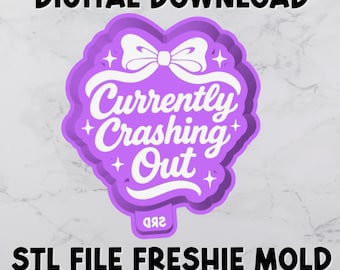 May include: A purple STL file freshie mold with the text "Currently Crashing Out" in white script. The design includes a bow and star accents. The words "Digital Download" and "STL File Freshie Mold Housing With Tab" are also present.
