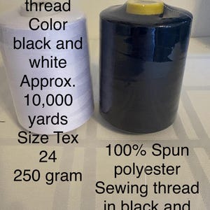 May include: Two spools of sewing thread, one white and one black. The white spool has text that reads "Sewing thread Color black and white Approx. 10,000 yards Size Tex 24 250 gram". The black spool has text that reads "100% Spun polyester Sewing thread in black and white".