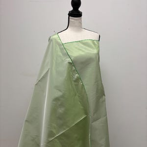 Lt. sage Taffeta fabric . Two tone fabric width 58&quot; polyester fabric made two color green and white. item # 115