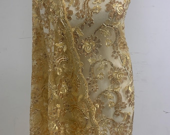3-yard Gold-colored lace fabric design named Angela, sequins and intricate embroidery with double scalloped edges. Width 49/50&quot;