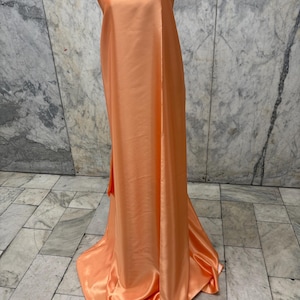 A 3 yards cut Crepe back satin fabric, color orange , polyester 58".