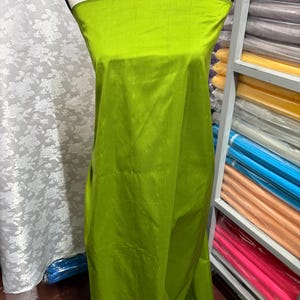 100% silk Dupioni Taffeta width 54&quot; color is Lt.Olive. Machine made, fabric has slubs. Item # 4. free sample.