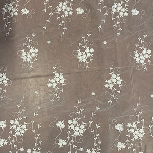 Organza Embroidery double scalloped color is combination of white/silver/ gray width 53/54&quot; 100% polyester