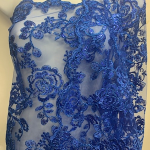 Royal Blue Lace fabric design floral style 04455911 color royal blue double scalloped sequins embroidery color width 49/50&quot;.100% polyester.