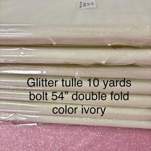 Ivory Tulle Gliter 54&quot; double fold, color Ivory with unicorn glitter 10 yards per pack.