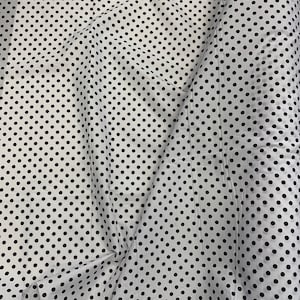 May include: White fabric with a black polka dot pattern. The fabric is folded in half and the polka dots are evenly spaced.