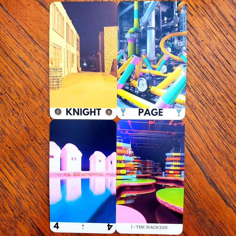 Four additional cards from the liminal space tarot deck on a wooden table. On the top left is the Knight of Pentacles, top right is the Page of Cups, bottom left is the Four of Swords, and bottom right is The Magician.