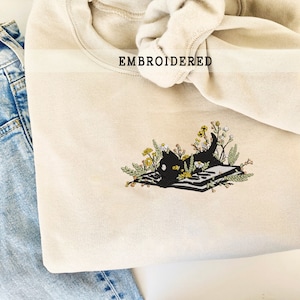 Embroidered Cat With Book And Flowers Sweatshirt, Cat Lover Gift, Wildflower Embroidery, Book Lover Gift, Embroider Booktrovert Crewneck