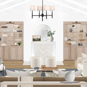 Puede incluir: Un diseño de interior de sala de estar con una chimenea blanca, un espejo redondo grande, una lámpara de araña negra, dos pufs blancos, una alfombra azul y dos estanterías empotradas con artículos decorativos.