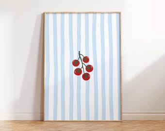 May include: Framed art print showing a bunch of red cherries with green stems on a blue and white striped background. The print is displayed on a wooden floor.