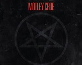 May include: Black and white album cover with a red pentagram inside a circle. The text "MÖTLEY CRÜE" is in red at the top and "SHOUT AT THE DEVIL" is in red at the bottom.