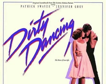 May include: A movie poster for the film "Dirty Dancing" featuring Patrick Swayze and Jennifer Grey. The title of the film is written in large, purple and blue letters. The tagline "The Time of Your Life" is written below the title. The poster also features a list of songs from the film's soundtrack.