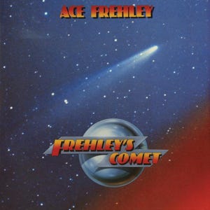 May include: Album cover art featuring the text "ACE FREHLEY" in orange and a comet streaking across a starry blue sky. Below, a silver sphere with the text "FREHLEY'S COMET" in orange and red.