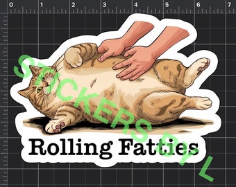 May include: A cartoon illustration of a large, orange tabby cat lying on its back with its paws in the air. Two hands are gently rubbing the cat's belly. The text "Rolling Fatties" is printed below the cat.