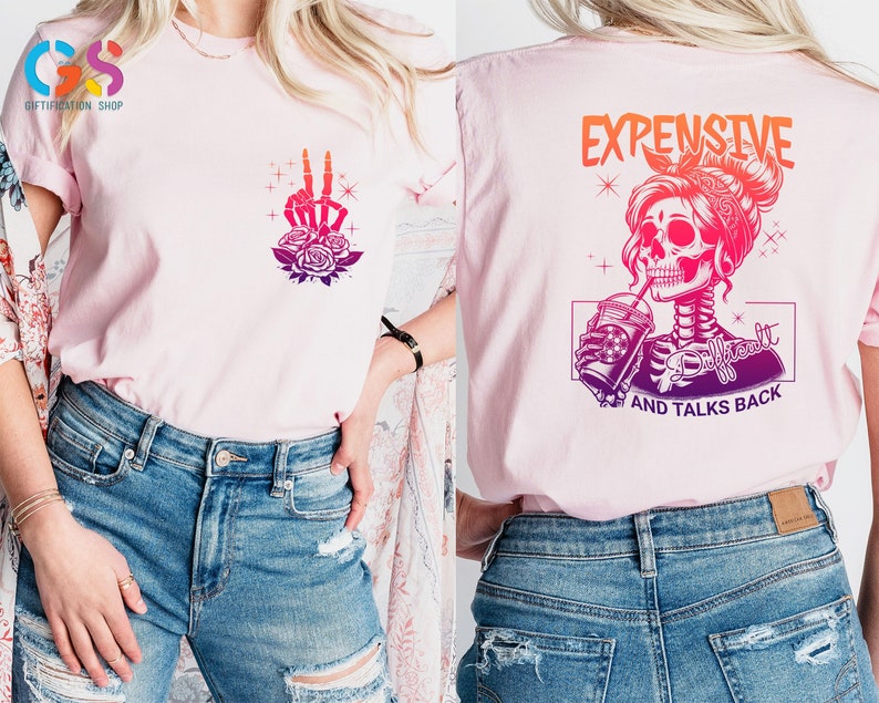 May include: Pink t-shirt with a graphic of a skeleton woman drinking a beverage with the text "Expensive, Difficult, and Talks Back".