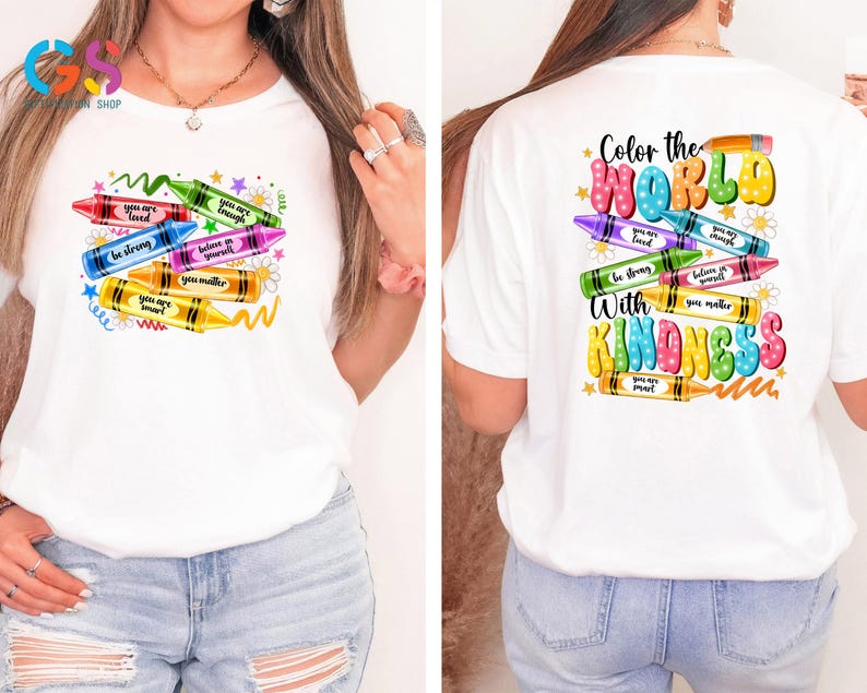 May include: White t-shirt with a colorful crayon design on the front and the text "Color the World with Kindness" on the back. The crayons have positive messages written on them, such as "You are loved", "Be strong", and "You matter".
