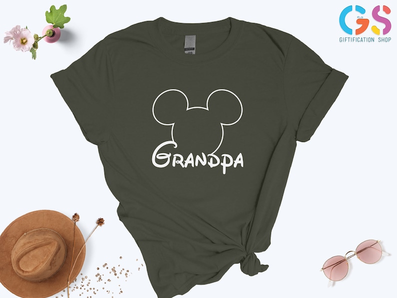 May include: A dark green t-shirt with a white outline of Mickey Mouse's head and the word "Grandpa" underneath.