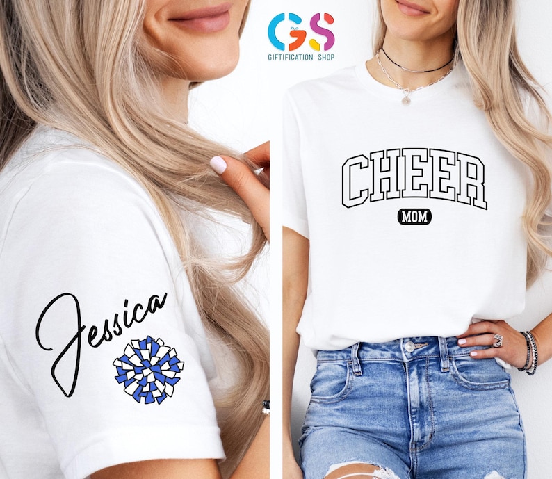 May include: White t-shirt with the text "CHEER MOM" in a black varsity-style font. The shirt also has a blue and white pom-pom and the name "Jessica" written in black cursive on the sleeve.
